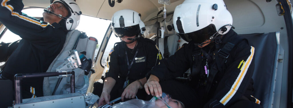 PHI Air Medical flight crew preparing for a high-risk pregnancy air transport
