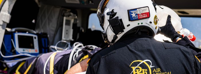 PHI Air Medical flight crew transferring a cardiac patient to the aircraft.