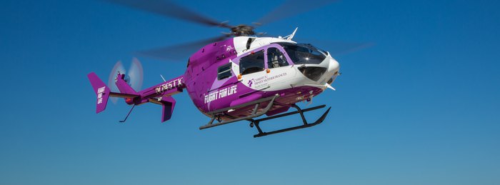 CHRISTUS Flight For Life helicopter in flight, showing partner air medical aircraft livery on a PHI Air Medical operated program.